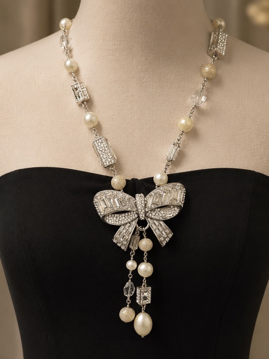 CHANEL Jewelry - CHANEL Silver-Tone Crystal Bow Necklace with Ivory Accents